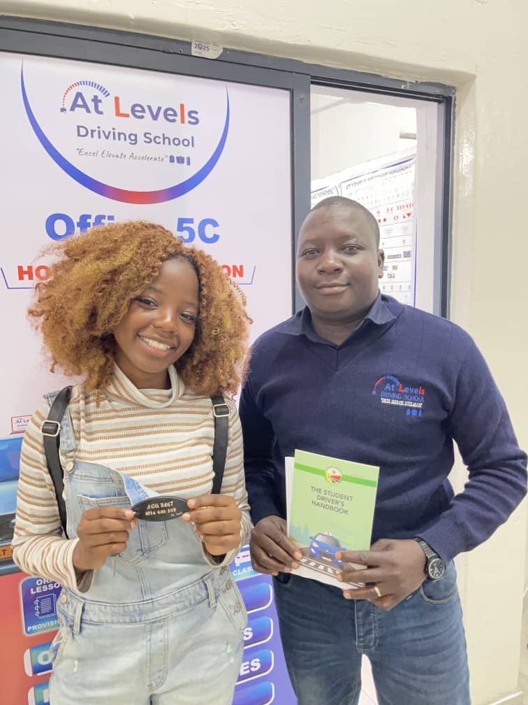 Certified driving instructor teaching student